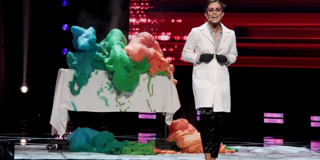 Miss Virginia 2019 Camille Schrier performs a science experiment during the talent portion of the Miss America 2020 Pageant Finals at Mohegan Sun on Dec. 19 in Uncasville, Conn.