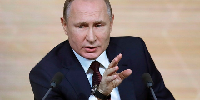 Russian President Vladimir Putin gestures during his annual news conference in Moscow, Russia, on Thursday.