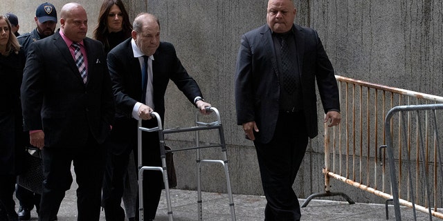 Harvey Weinstein, center, arrives for a court hearing, Wednesday, Dec. 11, 2019 in New York.