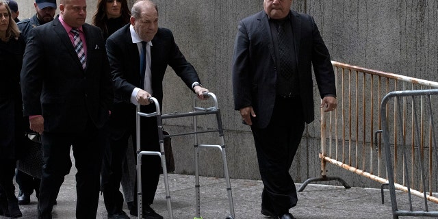 Harvey Weinstein, center, arrives for a court hearing, Wednesday, Dec. 11, 2019 in New York.