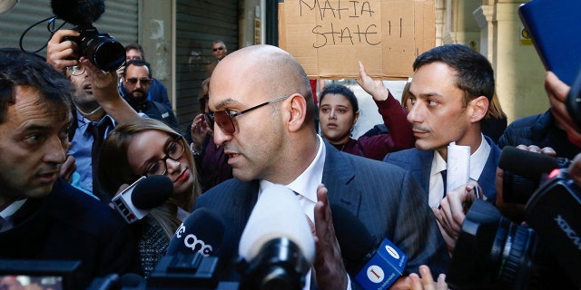 Fenech faced questions from the media after he left court Friday. (AP Photo/str)