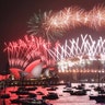 Sydney, Australia: Fireworks explode over the Sydney Harbour Bridge and the Sydney Opera House during New Year's Eve celebrations. 