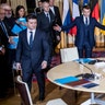 Russian President Vladimir Putin, French President Emmanuel Macron, and Ukrainian President Volodymyr Zelenskiy arrive at a working session at the Elysee Palace in Paris, Monday, Dec. 9, 2019. 