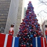 Toy soldiers stand next to the Christmas tree in FOX Square in New York City.