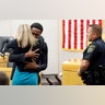 Botham Jean's younger brother Brandt Jean hugs convicted murderer and former Dallas Police Officer Amber Guyger after delivering a statement to her after she was sentenced to 10 years in jail in Dallas, Oct. 2, 2019. 