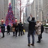 FOX fans photograph the Christmas tree in FOX Square in New York City.