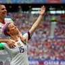 United States' Megan Rapinoe celebrates with teammate Alex Morgan after Rapinoe scored the opening goal during the Women's World Cup final soccer match between the U.S. and The Netherlands in Lyon, France, July 7, 2019. 