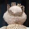 Britain's Queen Elizabeth II proceeds through the Royal Gallery before delivering the Queen's Speech during the State Opening of Parliament in London, Oct. 14, 2019. 