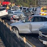 In this photo provided by the Virginia State Police, emergency personnel work the scene of the multi-vehicle pileup.