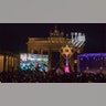 Berlin, Germany: People congregate for a public Menorah ceremony near the Brandenburg Gate.