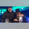 Budapest, Hungary: Hungarian Hasidic Jewish religious leader Baruch Oberlander, right, lights the first lantern on a menorah as mayor of the 13th district Jozsef Toth looks on in a square in central Budapest, Hungary.?