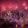 London, England: Fireworks explode over the London Eye Ferris Wheel by the River Thames to mark the start of the new year. (AP Photo/Matt Dunham)