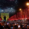 Paris, France: Revellers photograph fireworks over the Arc de Triomphe as they celebrate the New Year on the Champs Elysees. (AP Photo/Christophe Ena)