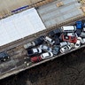 Crews work to clear vehicles from the Queens Creek overpass.