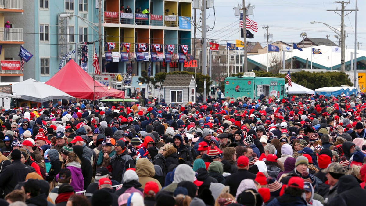 A crowd standing in the cold in front of the Wildwoods Convention Center as they waited to enter the rally. (AP Photo/Mel Evans)