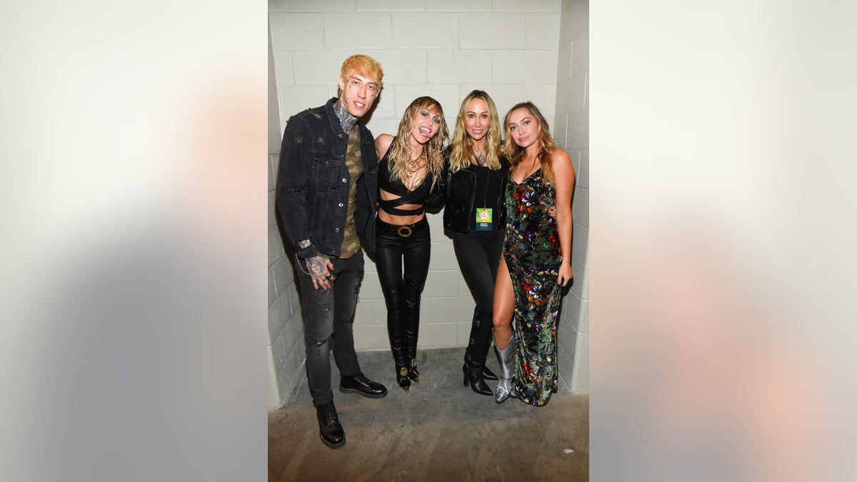 From left, Trace Cyrus, Miley Cyrus, Tish Cyrus and Brandi Cyrus pose backstage during the 2019 iHeartRadio Music Festival at T-Mobile Arena on September 21, 2019 in Las Vegas. (Photo by Kevin Mazur/Getty Images for iHeartMedia)