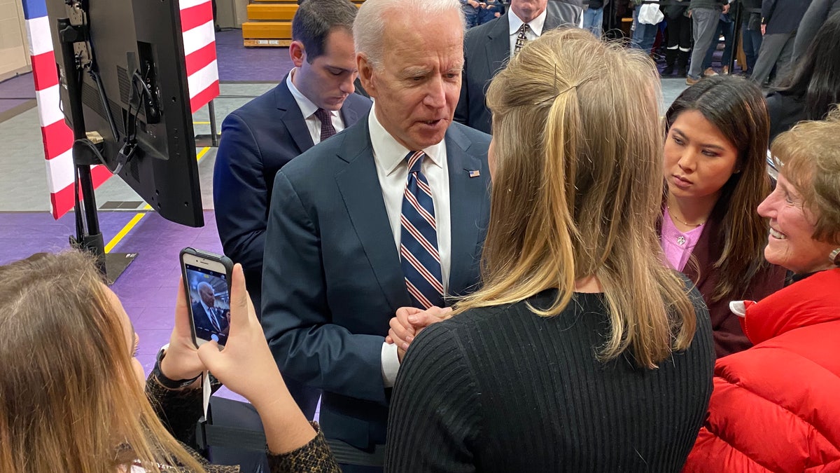 Former Vice President Joe Biden talks to voters after giving a campaign speech in Waukee, Iowa on Jan. 30, 2020