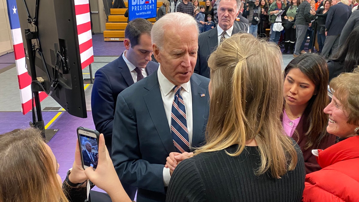 Former Vice President Joe Biden talks to voters after giving a campaign speech in Waukee, Iowa on Jan. 30, 2020