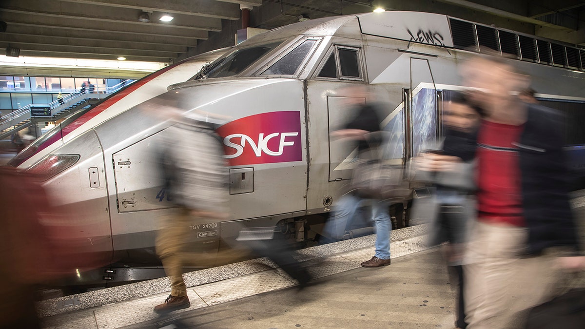 Travelers arrive at Gare Montparnasse train station during the 29th day of transport strikes in Paris, Thursday, Jan. 2, 2020. The start of 2020 was the second New Year celebration in a row where Macron has faced social upheaval. 