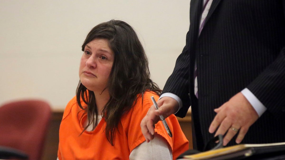 Heather Barbera, with her attorney James Leonard, speaks to  Atlantic County Superior Court Judge Bernard DeLury on Thursday before she was sentenced for the slaying of her mother and grandmother in their Ventnor condo. (Vernon Ogrodnek/The Philadelphia Inquirer via AP, Pool)