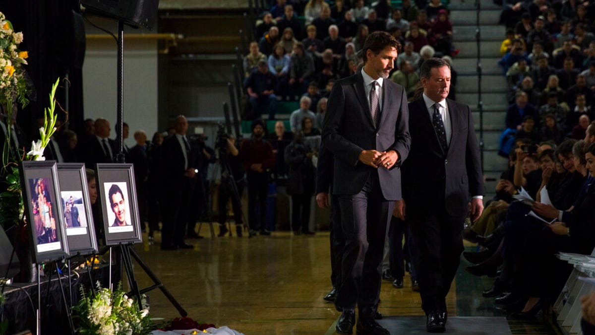 Canadian Prime Minister Justin Trudeau, left, with Alberta Premier Jason Kenney on Sunday during a memorial in Edmonton for the victims of the Ukrainian plane disaster in Iran this past week.