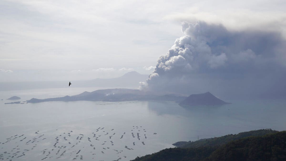 Taal Volcano continues to spew ash on Monday Jan. 13, 2020, in Tagaytay, Cavite province, south of Manila, Philippines. (AP Photo/Aaron Favila)