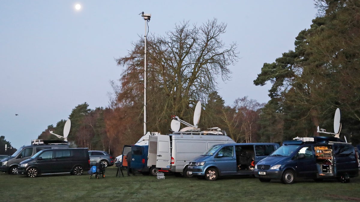 Media prepares in the early morning at the entrance of the castle in Sandringham, England, Monday, Jan. 13, 2020.
