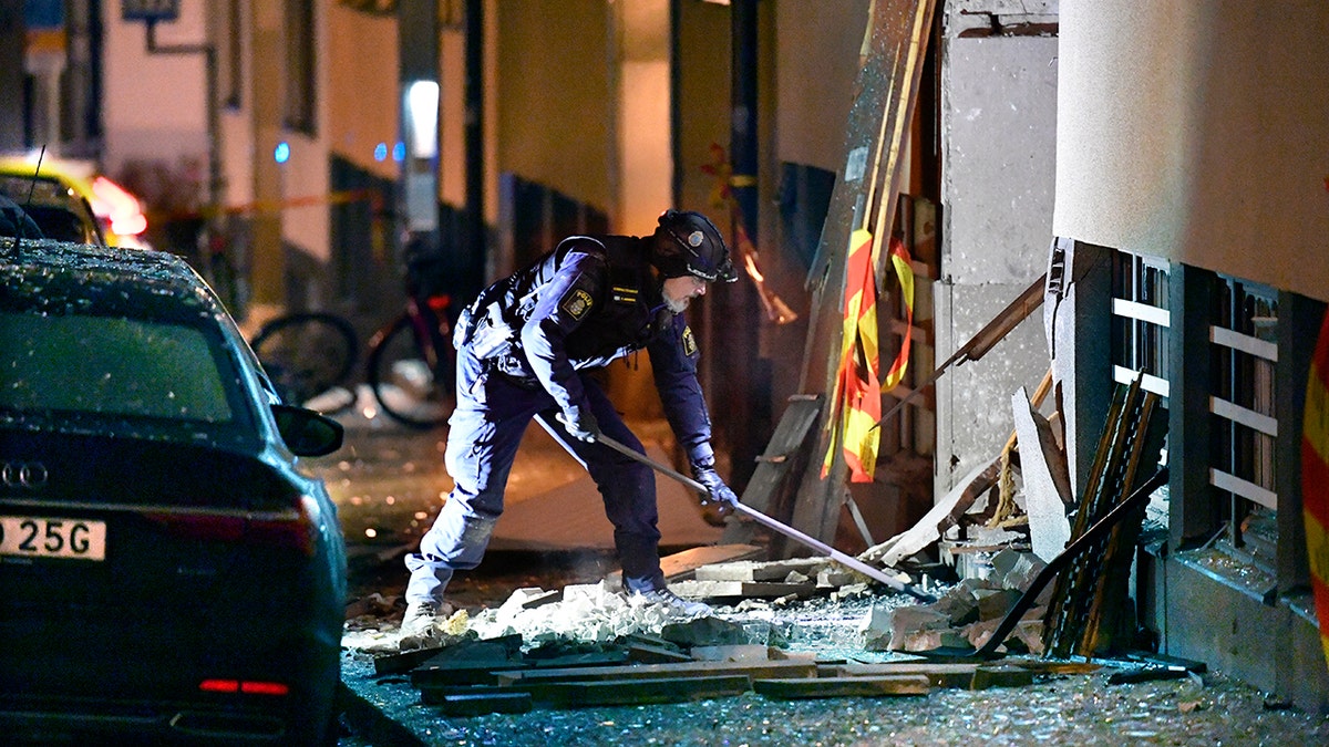 Police work at the scene of an explosion that caused damage to a residential building in central Stockholm, early Monday, Jan. 13, 2020. There were no reported injuries. (Anders Wiklund/TT News Agency via AP)