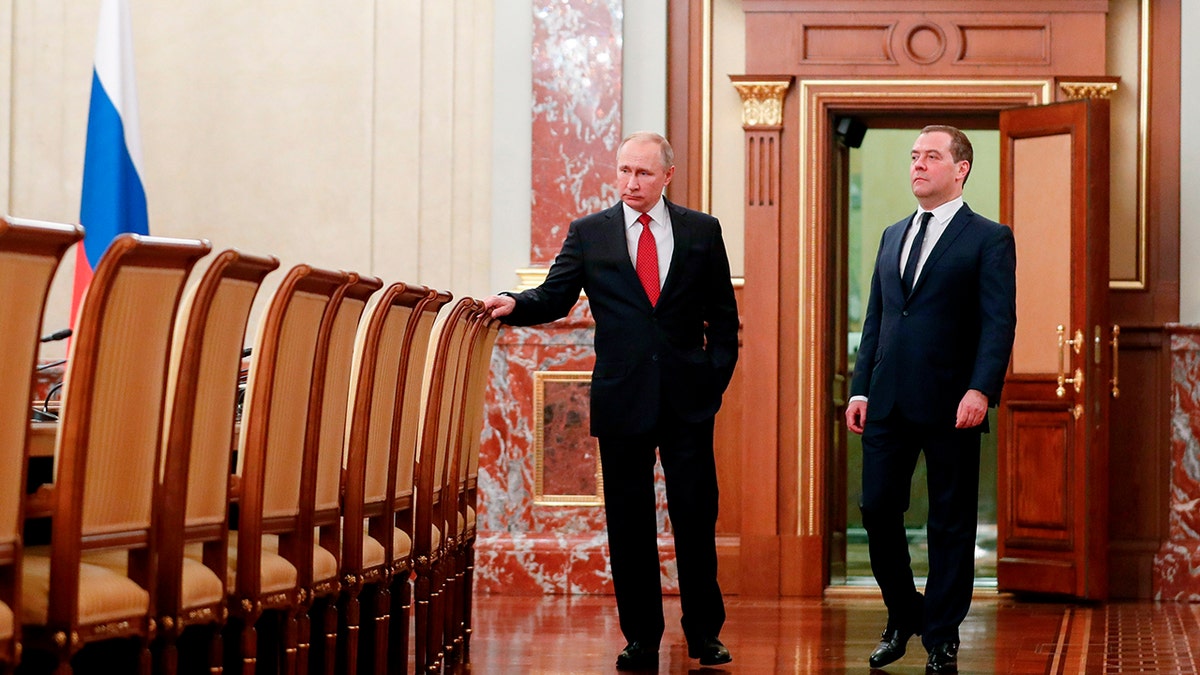 Russian President Vladimir Putin, right, and Russian Prime Minister Dmitry Medvedev before a cabinet meeting in Moscow on Wednesday. (Dmitry Astakhov, Sputnik, Government Pool Photo via AP)