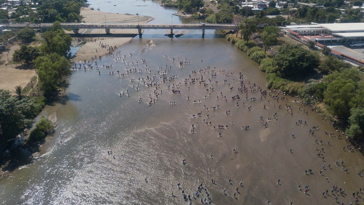 Central American migrants cross the Suchiate River by foot from Tecun Uman, Guatemala. (AP Photo/Santiago Billy)