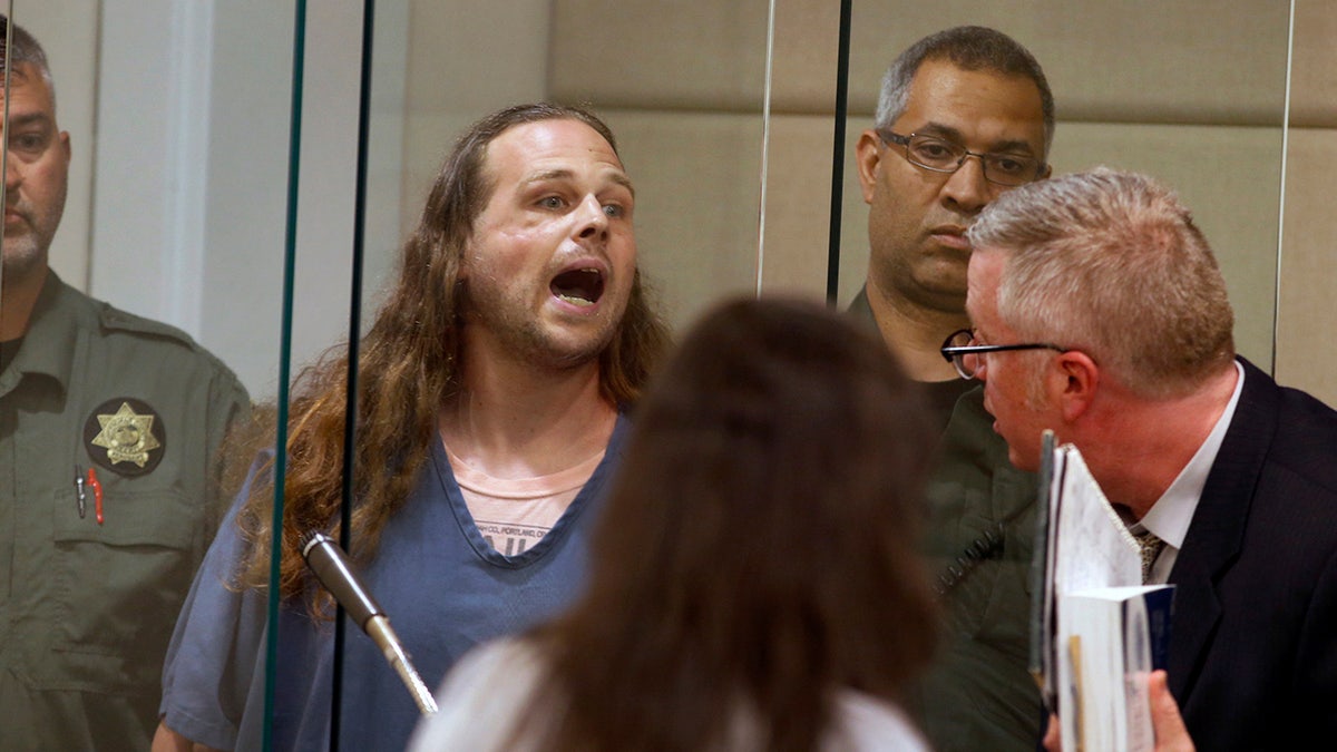 In this 2017 photo, Jeremy Christian shouts as he is arraigned in Multnomah County Circuit Court in Portland, Ore. (Beth Nakamura/The Oregonian via AP, Pool, File)