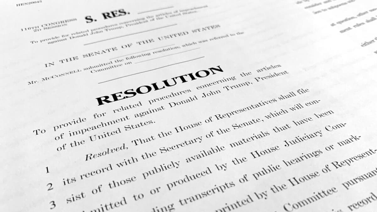 A copy of a Senate draft resolution to be offered by Senate Majority Leader Mitch McConnell, R-Ky., regarding the procedures during the impeachment trial of President Trump. (AP Photo/Jon Elswick)
