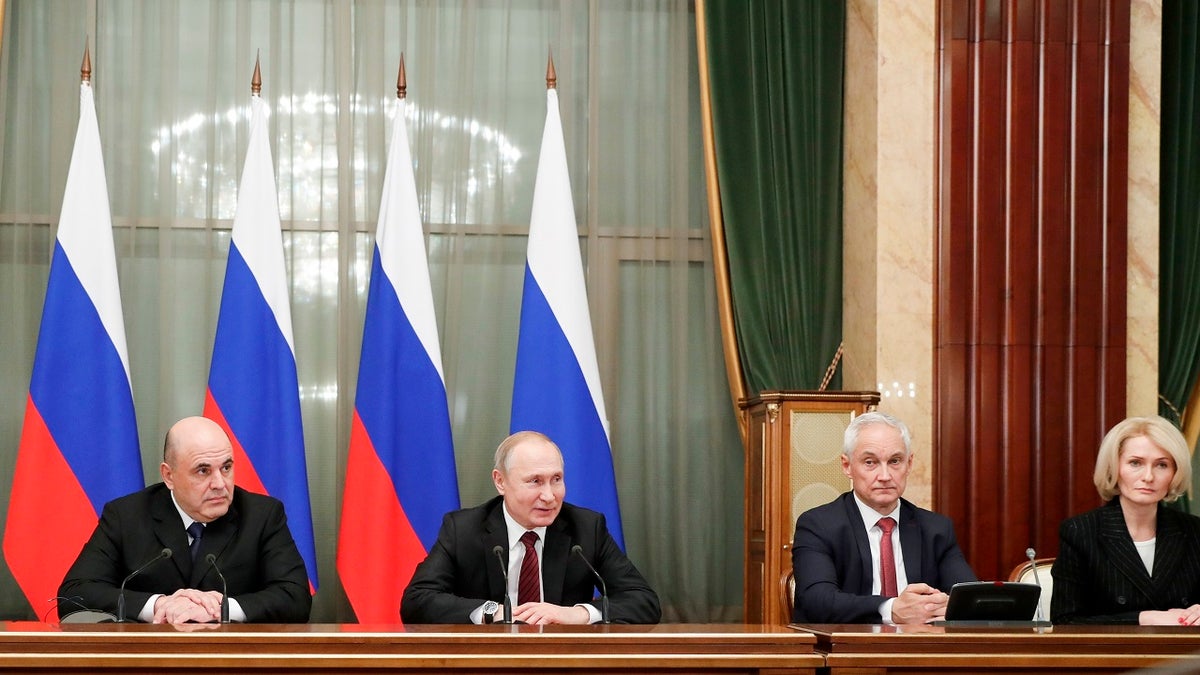 Russian President Vladimir Putin, second left, new Russian Prime Minister Mikhail Mishustin, left, former Putin's economic adviser Andrei Belousov, appointed as a first deputy Prime Minister, second right, and deputy Prime Minister Viktoria Abramchenko attend a new cabinet meeting in Moscow on Tuesday. Putin formed his new Cabinet Tuesday, replacing many of its members but keeping his foreign, defense and finance ministers in place. (Dmitry Astakhov, Sputnik, Government Pool Photo via AP)