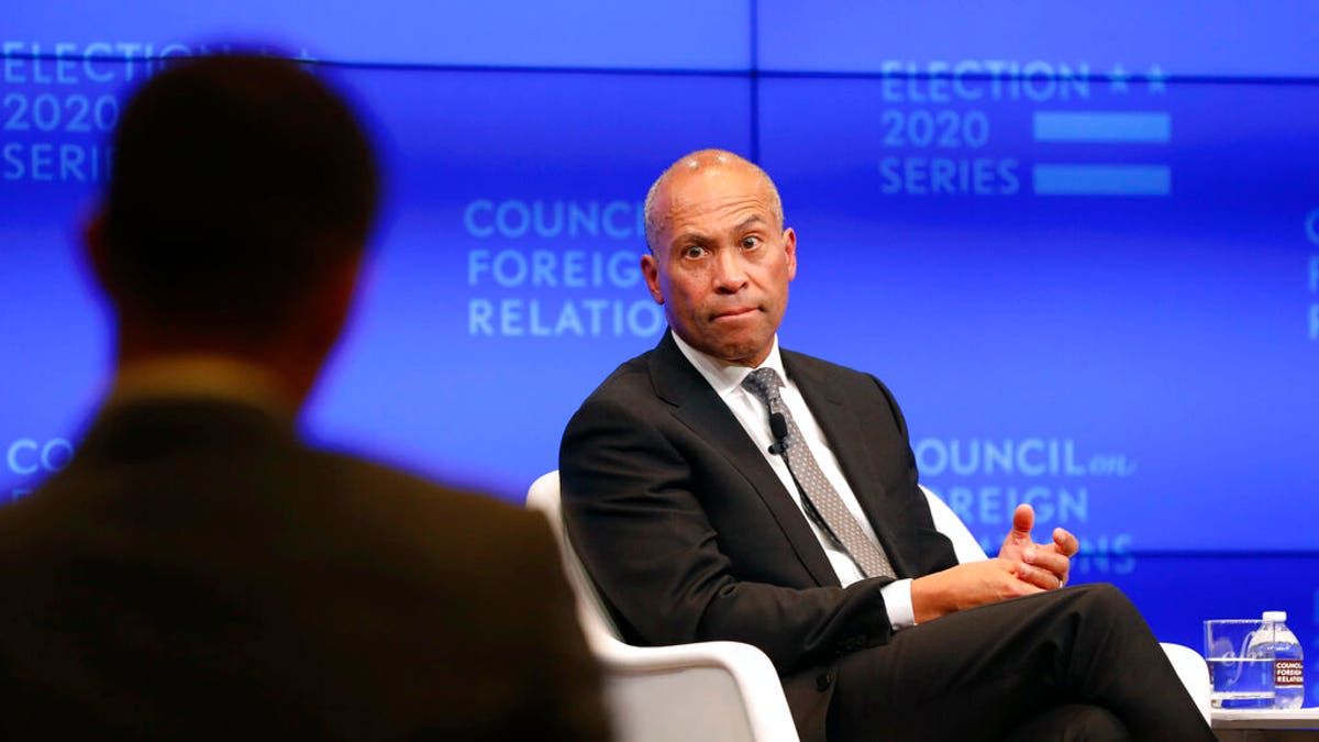 Former Massachusetts governor and 2020 Democratic presidential candidate Deval Patrick, right, takes a question at the Council on Foreign Relations.