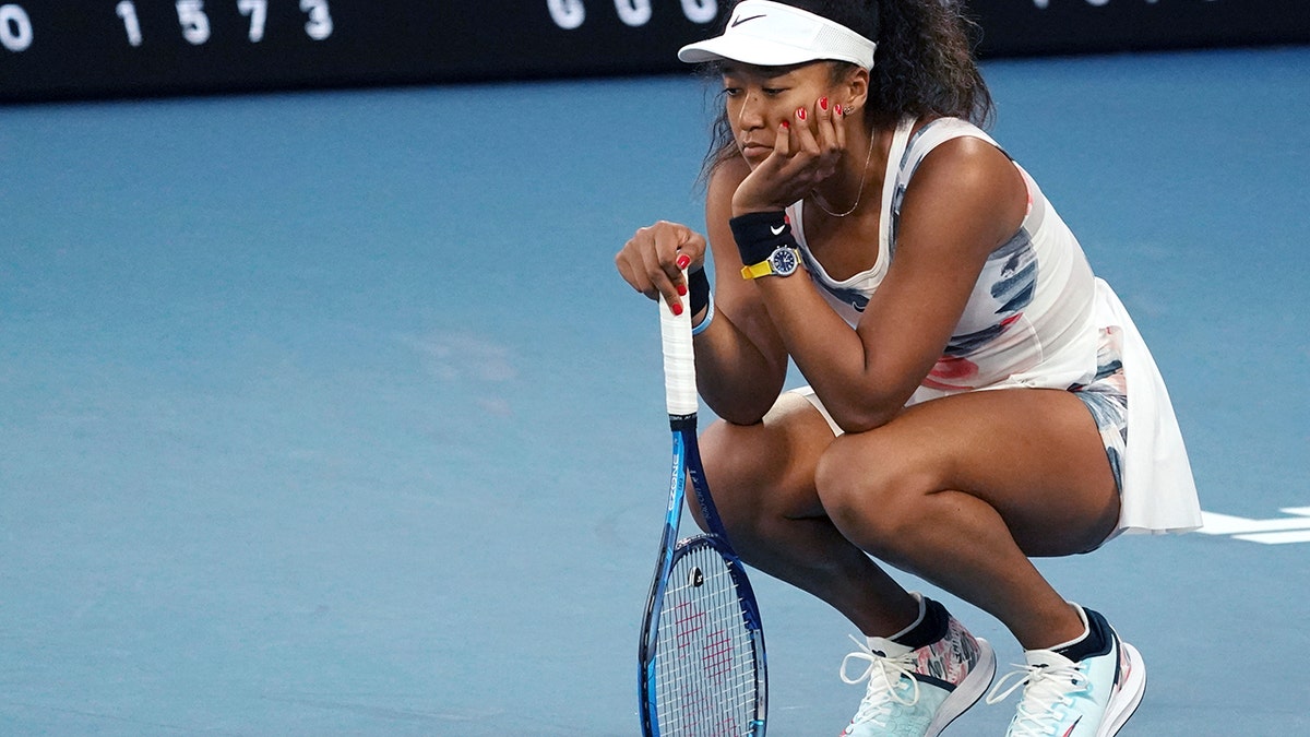 Japan's Naomi Osaka reacts during her third-round loss to Coco Gauff of the U.S. at the Australian Open tennis championship in Melbourne, Australia, Friday, Jan. 24, 2020. (AP Photo/Lee Jin-man)