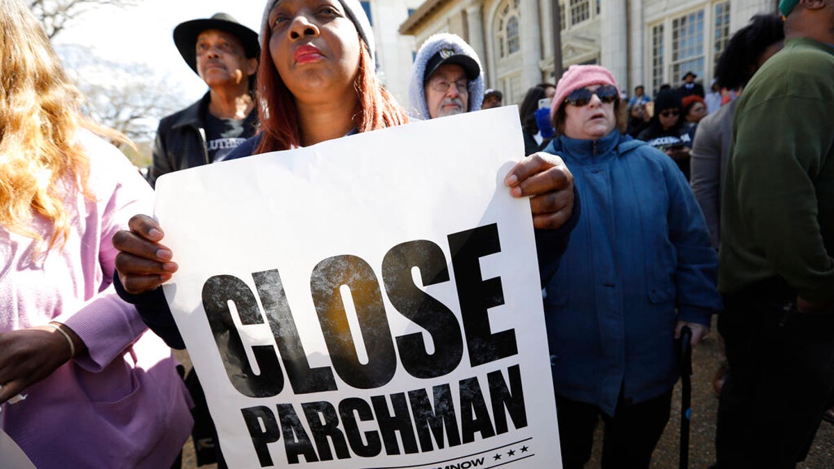 Many attendees of a rally at the Mississippi Capitol in Jackson, carried signs that protested conditions in prisons where inmates have been killed in violent clashes in recent weeks.