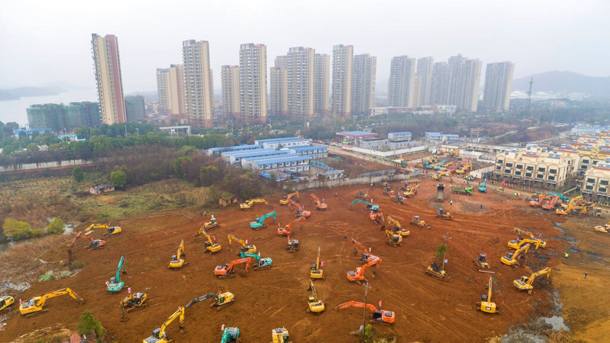 Heavy equipment at a construction site for a field hospital in Wuhan in central China's Hubei Province. 