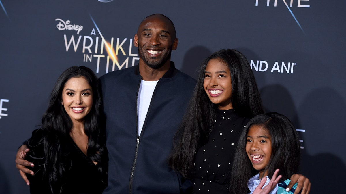 ​​​​​​​Vanessa Bryant, left, Kobe Bryant, Natalia Bryant and Gianna Maria-Onore Bryant are seen in Los Angeles, Feb. 26, 2018, nearly two years before Kobe and Gianna Bryant died in a helicopter crash on Jan. 26, 2020. (Associated Press)