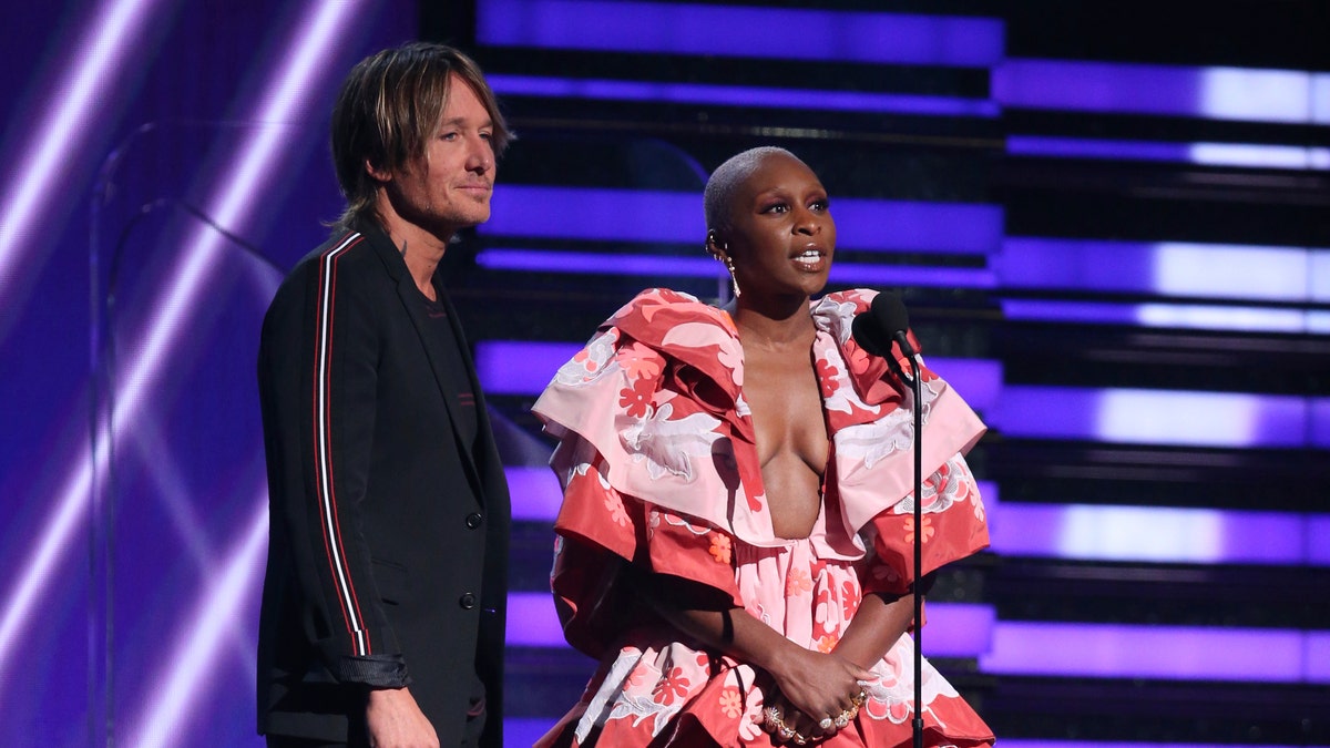 Keith Urban, left, and Cynthia Erivo present the award for best pop solo performance at the 62nd annual Grammy Awards on Sunday, Jan. 26, 2020, in Los Angeles.