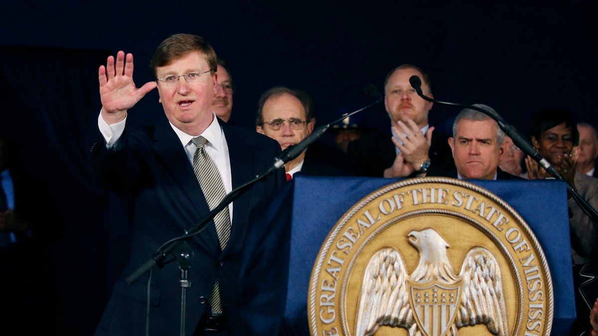 Gov. Tate Reeves waves to the audience after delivering his State of the State address before a joint session of the Legislature, outside the Capitol in Jackson, Miss., Monday, Jan. 27, 2020. (AP Photo/Rogelio V. Solis)