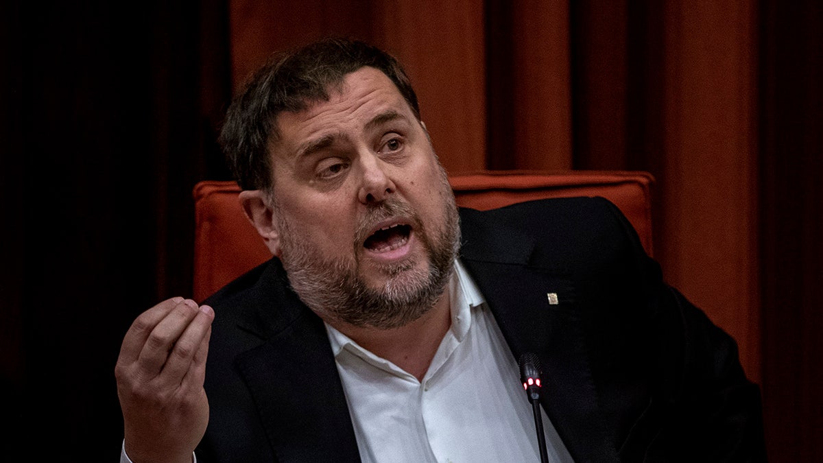 Catalonia's ex-regional vice-president Oriol Junqueras speaks at the Parliament of Catalonia in Barcelona, Spain, Tuesday, Jan. 28, 2020. Six former members of Catalonia's regional government have been escorted from prison to attend a hearing at the regional parliament in Barcelona. (AP Photo/Emilio Morenatti)