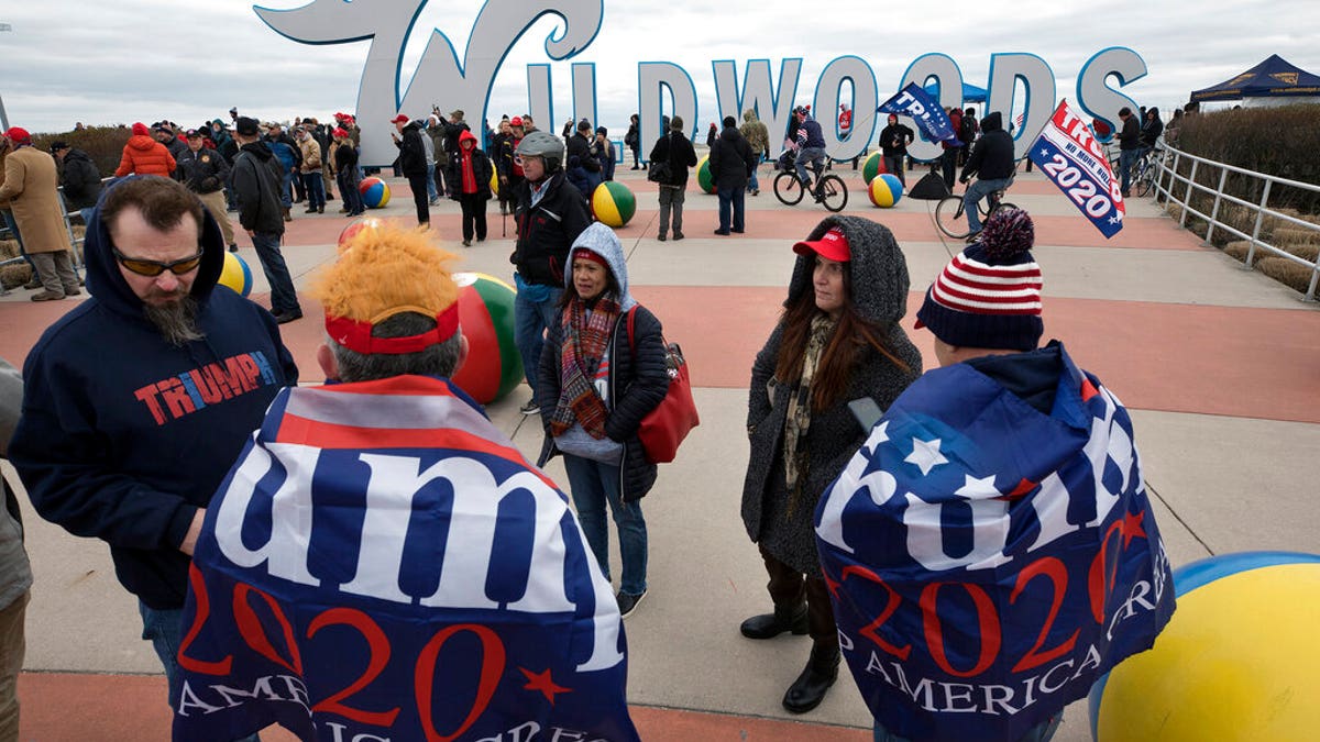 Supporters of President Trump supporters in a crowd near the iconic Wildwoods sign Tuesday. (AP Photo/Mel Evans)