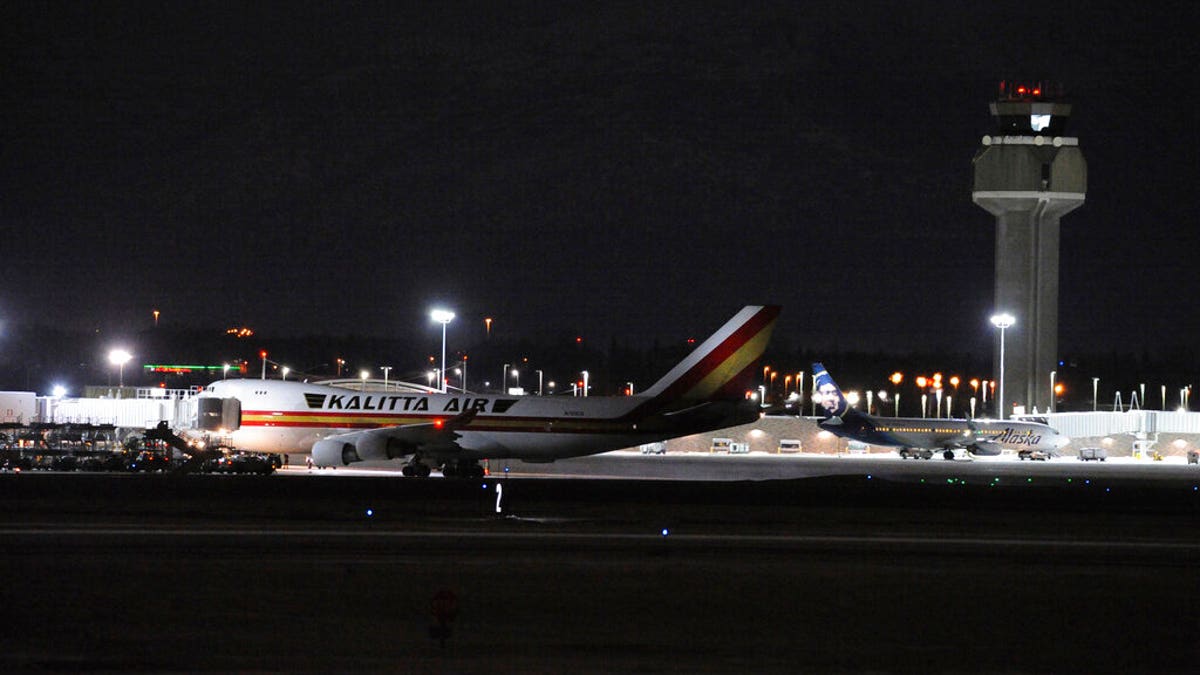 The aircraft carrying hundreds of American diplomats and citizens, sitting on the tarmac of Ted Stevens Anchorage International Airport in Anchorage, Alaska, on Tuesday.