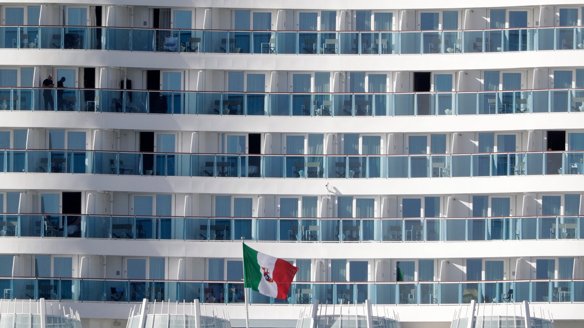 Passengers wait aboard the Costa Smeralda cruise ship, docked in the Civitavecchia port near Rome. (AP Photo/Andrew Medichini)