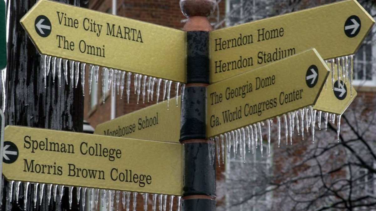 In this Jan. 23, 2000, file photo, ice forms on a street sign following an overnight ice storm in Atlanta.