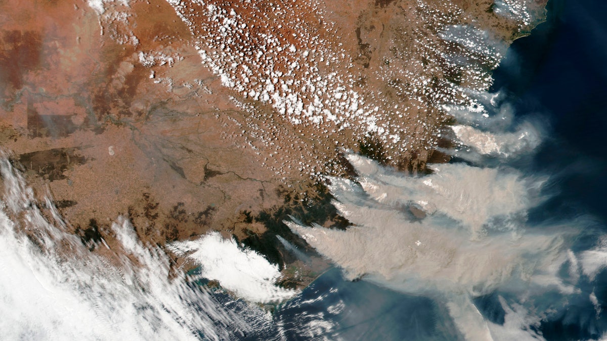 This satellite image provided by NASA on Saturday, Jan. 4, 2020 shows wildfires in Victoria and New South Wales, Australia.