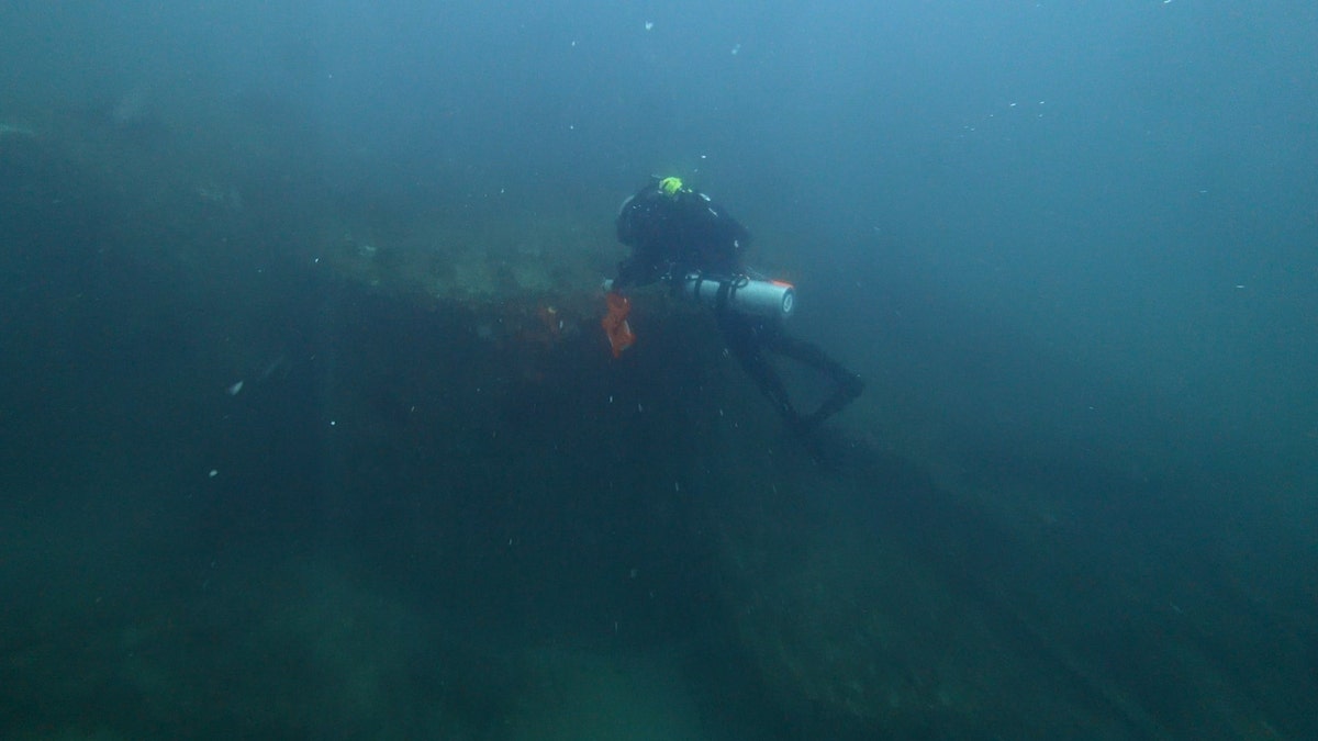 Diver Joe Citelli inspecting the SS Cotopaxi shipwreck.