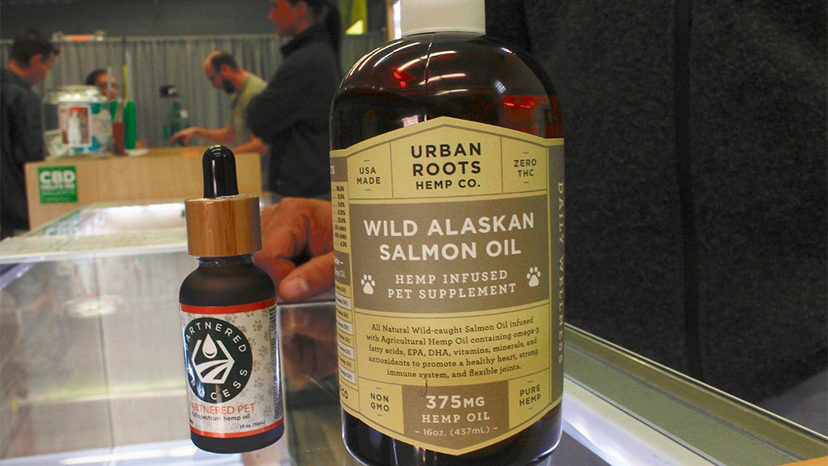This Oct. 17, 2019 photo taken at the CBD dispensary Laughing Grass in West Allis, Wis. shows various CBD products for pets. (AP Photo/Carrie Antlfinger)