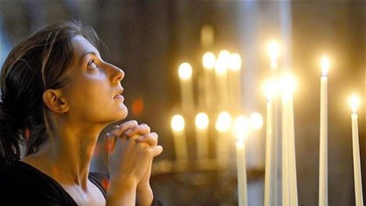 Photo of a woman praying.
