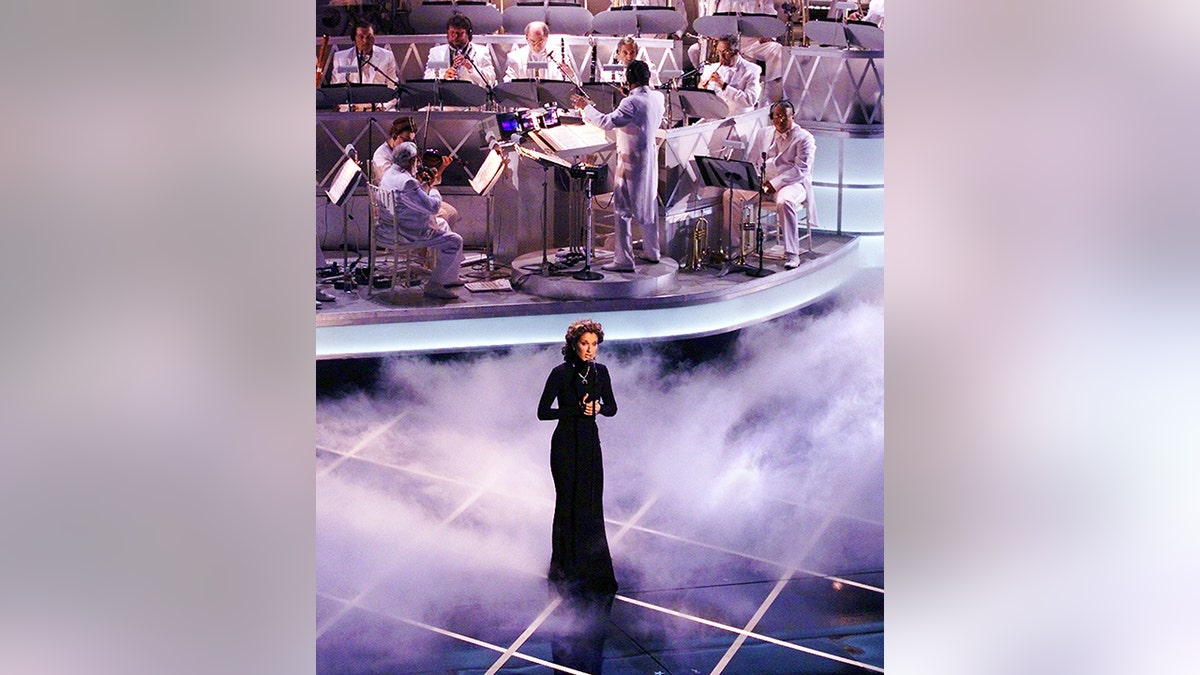 Celine Dion performs "My Heart Will Go On" during the 70th Academy Awards at the Shrine Auditorium during the 70th Academy Awards. "My Heart Will Go On" won the Oscar for best original song.